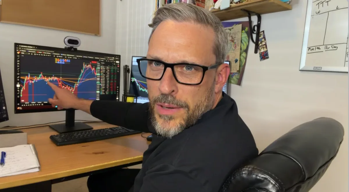 Educator teaching at trading desk